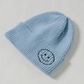 Light blue knitted beanie with black smiley face embroidery for kids and toddlers - Core Spinning / Sky Blue