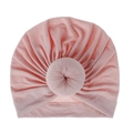 Close-up detail of a soft pink baby donut turban headwrap with pleated fabric texture - One Size / Pink