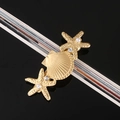 Detalle de la pinza dorada de estrella de mar y concha con perlas y diamantes de imitación - Estrella de Mar Concha Juego de 3 Piezas / Oro rosa