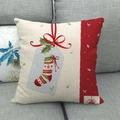 Christmas linen pillowcase with festive red stocking print on a grey sofa - Style 11