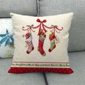 Beige linen Christmas pillowcase with three hanging stockings and holly berry motifs - Style 5