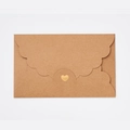 Brown kraft paper envelope with scalloped edges and a golden heart for invitations - Kraft Paper