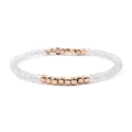 Elastic bracelet featuring white faceted crystal beads and rose gold square metal spacers - Greyish White + Gold