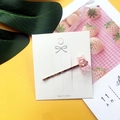 Pink jelly gummy bear hair clip with gold metal finish shown on a white display card - Pink
