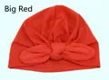 Bright red baby turban hat featuring a large knot bow in soft breathable knit fabric - Red