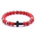 Elastic beaded bracelet featuring red round stones with a black cross pendant and silver spacers - Red Turquoise With Black Cross / Red