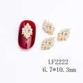 Golden sun-shaped nail charm with white pearls and center rhinestone, size 6.7x10.3mm - Golden Pearl Rhinestone Rhombus (2222)