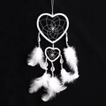 Handmade white double heart dreamcatcher with feathers and shells on black background - White