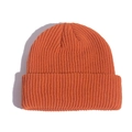 Orange ribbed knit docker cap with folded brim for winter warmth shown on white background - Caramel