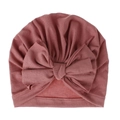 Dettaglio del cappello a turbante per neonati in cotone rosa con fiocco decorato - Rosa Antico