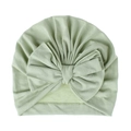 Turbante per neonati verde menta in morbida maglia con grande fiocco decorativo su fondo bianco - Verde chiaro