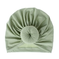 Detail view of sage green newborn turban hat with soft donut knot and ribbed texture - One Size / Light Green