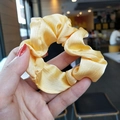 Vibrant yellow satin texture fabric scrunchie with elegant pleated silk-like finish - Yellow