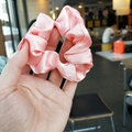 Pink satin scrunchie with pearlescent sheen and elegant pleated texture for hair - Pink