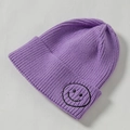 Knitted purple beanie for kids featuring a minimalist black embroidered smiley face patch - Core Spinning / Purple