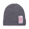 Detail of grey ribbed knit beanie for kids with white fashion label on white background - Gray