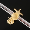 Detailed view of a golden metal starfish and seashell hair clip with textured starfish design - Starfish Shell 5-Piece Set / Rose Gold