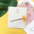 Cute yellow gummy bear hair clip with translucent acrylic resin on a gold metal barrette - Orange