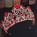 Close-up of gold baroque bridal crown with red crystals and intricate floral details - KC Gold Red Rhinestone