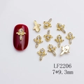 Golden alloy sunflower nail charms with white rhinestones on red nails, 7x9.3mm size - Symmetrical Floral Structure (2206)