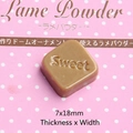 Macro shot of a square brown resin chocolate charm with Sweet engraving for DIY crafts - Small 'Sweet' Style - Light Coffee