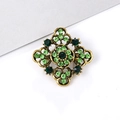 Vintage bronze brooch with green rhinestones in a floral cross design on white surface - Cross Shape - Green Rhinestone (XD639-4)