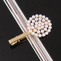 Detailed macro view of a circular pearl cluster arrangement on a golden metal hair clip - Full Pearl Disk Alloy Bobby Pin