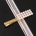 Detail of gold metal hair clip with double rows of white pearls on black mirror background - Rectangular Pearl Alloy Bobby Pin