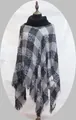 Women's turtleneck knit poncho in black and white plaid pattern with fringed hem - One Size / Black/White/Grey Plaid