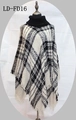 Women's turtleneck knit poncho in black and white plaid pattern with decorative tassels - One Size / Black & White Check