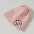 Rosafarbene Strickmütze für Kinder mit einem niedlichen bestickten Smiley-Patch - Umspinnung / Rosa