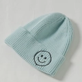 Kids knitted beanie in light blue with black embroidered smiley face detail - Core Spinning / Light Blue