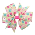 Close-up of floral ribbon bow hair clip showing textured grosgrain fabric and patterns - Light Green Floral
