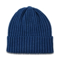 Close-up of dark blue ribbed knit pattern and soft texture on this winter beanie - Blue