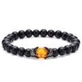 Macro shot of tiger eye stone bead and black matte beads with royal crown charms - Matte Stone