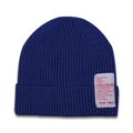 Detail of blue ribbed knit beanie featuring a white rectangular woven patch with red text - Sapphire Blue