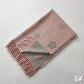 Detail of pink and grey camellia jacquard scarf showing soft texture and tassel fringes - Pink