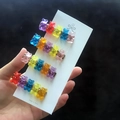 Detailed view of four colorful gradient resin bear hair clips on a white card display - 4 Pieces Set Duckbill Clips