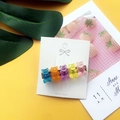 Detail of colorful acrylic gummy bears on a metal hair clip over a yellow background - Duckbill Clip No.4