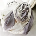 Elegant white to deep grey gradient linen scarf with fringe edges on a white table - Light Grey + White