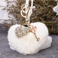White faux fur heart keychain with gold clover charm and colorful cat eye stone pendant - White