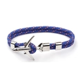 Detailed macro view of woven blue rope bracelet with silver airplane charm - Blue Patterned