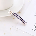 Paire de barrettes dorées élégantes avec strass bleus sur une assiette décorative blanche - Lot de 2 / Bleu Royal