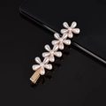 Macro detail of hand-woven pearl hair clip with five white flowers on golden base - Four Plum Blossoms