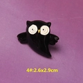 Macro detail of black resin owl brooch pin for DIY accessories on purple fabric background - Style 4 Black Owl