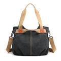 Minimalist canvas tote bag in black with khaki straps and orange leather accents - Black