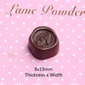 Macro view of a 19mm brown resin chocolate charm with an elegant engraved letter A - Small Letter A - Dark Coffee
