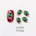Detailed view of 7x12mm green oval vintage nail art gem with gold base and rhinestones - 2561 Deep Green