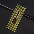 Close-up of golden rectangular hair clip with neat rows of vibrant green beads - Bean Green Rectangle