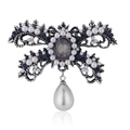 Vintage brooch with rhinestones, white pearls, and water-drop pendant on white background - Bow/Teardrop Pearl (C039-B) / Silver